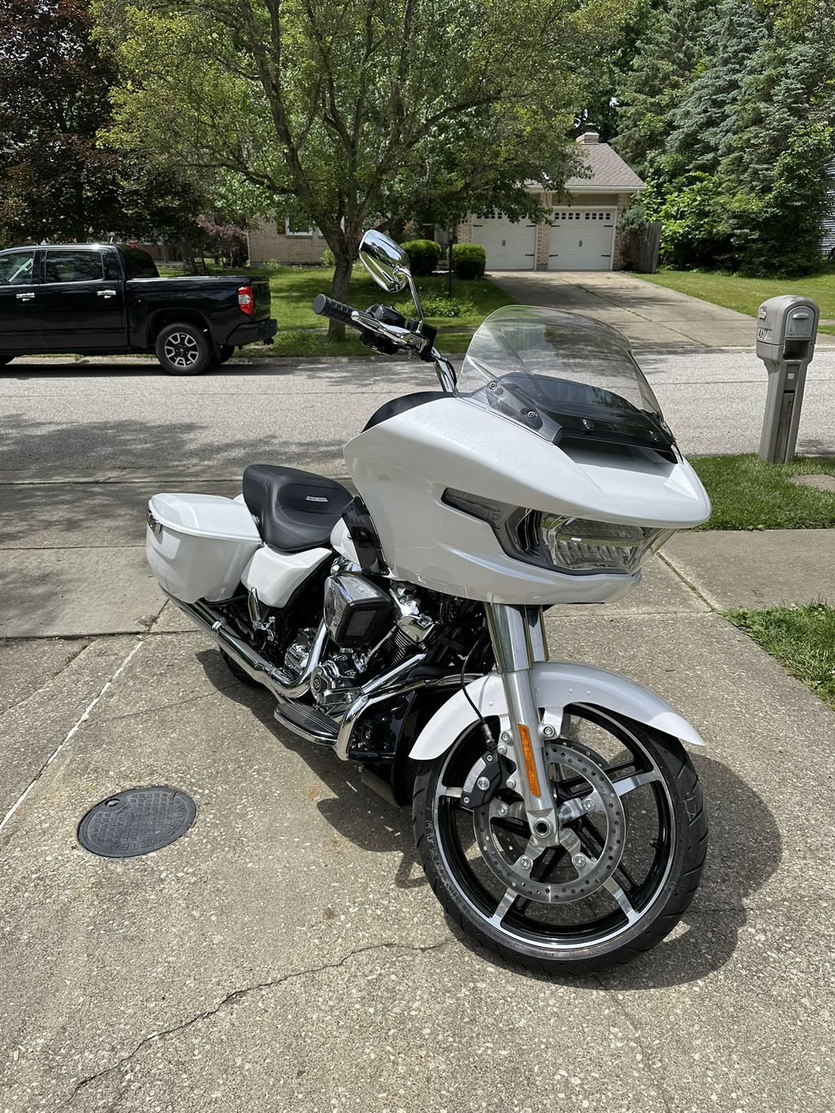 White Harley-Davidson Road Glide fitted with tall chrome ape hanger handlebars