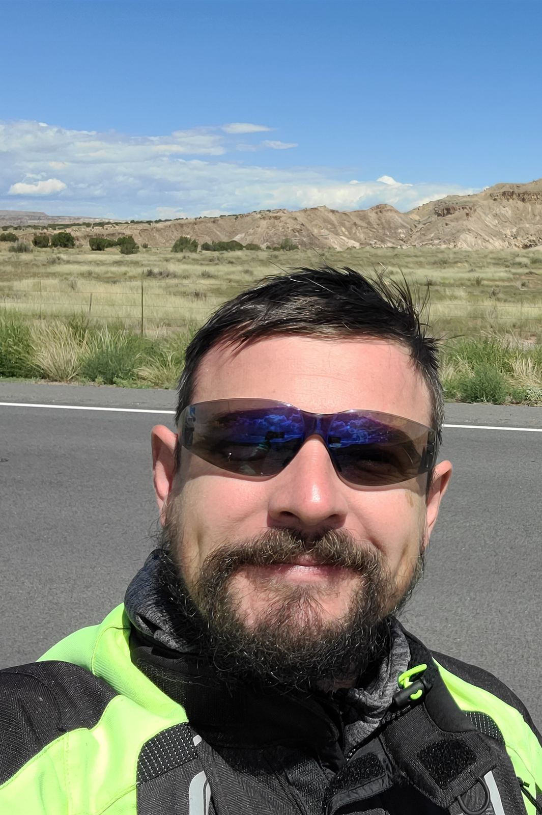 Vidmantas Steponavicius, founder of Tailored Moto, in riding gear on the road